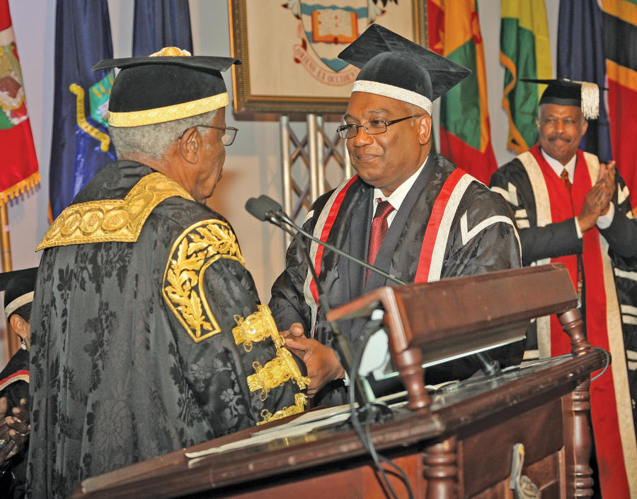 Professor Brian Copeland, Campus Principal at The UWI St Augustine is inducted by then Chancellor, Sir George Alleyne.