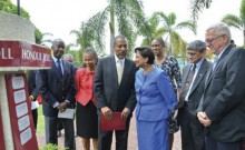 Hon. Kamla Persad-Bissessar became the first female Head of State to be inducted into the UWI Mona Park in Honour of Graduates who are or have been Heads of Government. L-R: C. William Iton, University Registrar; Dr. Camille Bell-Hutchinson, Campus Registrar, Mona; Professor Gordon Shirley, Pro Vice Chancellor and Principal, Mona; Hon Kamla Persad- Bissessar, Prime Minister of Trinidad and Tobago; Dr. Gregory Bissessar; Rev. the Hon. Ronald Thwaites, Minister of Education. Second row: H.E. Dr. Iva Gloudo...