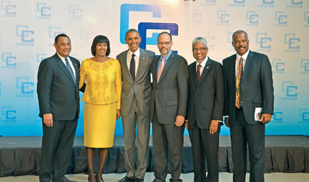 From left: Prime Minister of the Commonwealth of The Bahamas and Chairman of CARICOM, the Rt. Hon. Perry Christie; Prime Minister of Jamaica, the Most Hon. Portia Simpson Miller; President of the United States, Barack Obama; Secretary General of CARICOM, Irwin LaRocque; Out-going Vice-Chancellor of The UWI, Professor E. Nigel Harris; and Vice-Chancellor Designate, Professor Sir Hilary Beckles in a group photo during the summit held at The UWI.