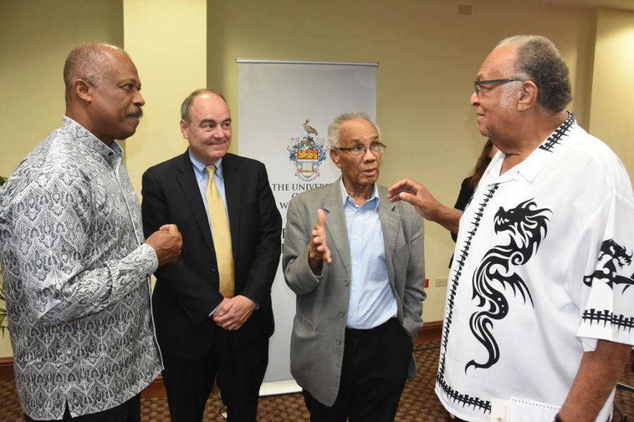 (l-r) Vice-Chancellor, Professor Sir Hilary Beckles, with Professor Stephen Hanson, Vice Provost for International Affairs and Director of Reves Center for International Studies, College of Williams and Mary, USA; Ambassador Carlton Davis, OJ; and Ambassador Derrick Heaven, following Professor Hanson's presentation at The UWI Regional Headquarters on 'The Novelty of Putin's Patrimonialism'.