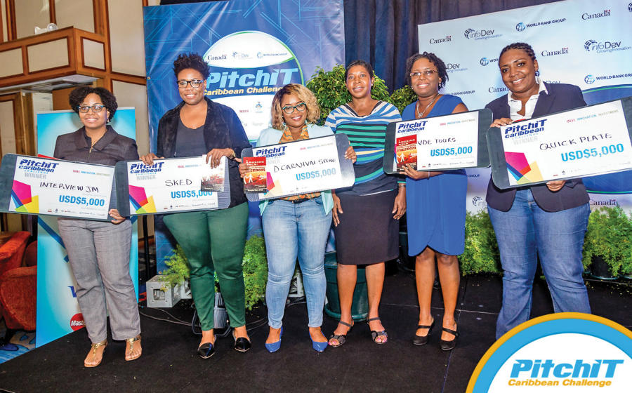Winning teams from the PitchIT Caribbean Challenge competition show off their US$5,000 prizes for finishing in the top five following two days of competition in Port of Spain, Trinidad from December 2-3, 2016. From left: Danielle Tait of The Interview JM from Jamaica, Kelly-Ann Bethel of SKED from Trinidad & Tobago; Ayana St. Louis of D Carnival Scene from Trinidad & Tobago; Karlene Francis, World Bank's Programme Officer of the Entrepreneurship Programme for Innovation in the Caribbean (EPIC); Nerissa Greenway representing IndeTours from Montserrat and Monique Powell of QuickPlate, Jamaica.