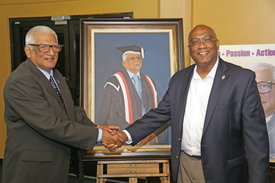 Professor Clement Sankat (left) with his successor,
Professor Brian Copeland at Professor Sankat's official farewell.